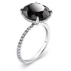 a black and white diamond ring on a white background