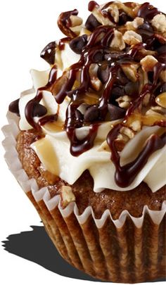 a cupcake with nuts and chocolate on top