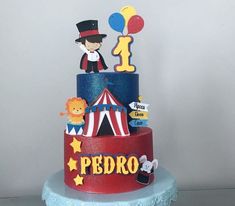 a three tiered circus themed birthday cake