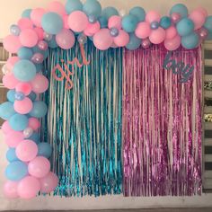 balloons and streamers decorate the backdrop for a party