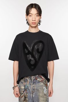 Crew neck t-shirt features a seasonal heart logo animation at the front and Acne Studios logo at the back. Cut to a relaxed unisex fit. Oversized Tops With Heart Graphic For Streetwear, Oversized Heart Graphic Top For Streetwear, Oversized Heart Graphic T-shirt With Crew Neck, Oversized Heart Graphic Crew Neck T-shirt, Oversized Crew Neck T-shirt With Heart Graphic, Oversized Heart Graphic T-shirt For Streetwear, Relaxed Fit Heart Graphic Tops For Streetwear, Suit Jacket Dress, Denim T Shirt