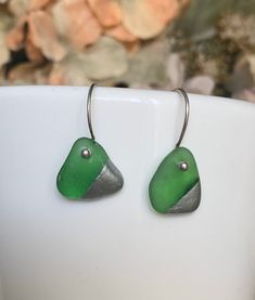 "Bring a piece work of the sea with you. Authentic sea glass that I have found along the shore, after being tumbled by the surf upon the sand and rocks, making it smooth and frosty naturally! I have hand-drilled genuine pieces of sea glass and set them onto sterling silver or gold filled hoops. All natural sea glass varies in shape. These sea glass hoops earrings are fun and a little flirty. Genuine sea glass from California available in - Emerald Green - White - Brown/Amber - seafoam. Please le Silver Sea Glass Earrings For Gift, Elegant Silver Sea Glass Earrings, Silver Sea Glass Earrings For Beach, Nickel-free Blue Sea Glass Earrings, White Sea Glass, Nickel-free Blue Sea Glass Jewelry, Gold Filled Hoops, Gold Filled Earrings, Simple Earrings