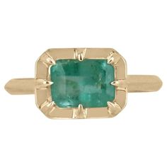 Introducing a captivating solitaire emerald ring that exudes charm and grace. This stunning piece features an approximate 1.75-carat natural emerald cut emerald, delicately set east to west in an elegant 8 prong setting. The emerald boasts a beautiful light spring green color, evoking a sense of freshness and vitality. Its unique characteristics add a touch of individuality and charm to the ring. Crafted with meticulous attention to detail, the ring is set and crafted in 14k gold, showcasing a h Spring Green Color, Smaragd Ring, Emerald Gem, Ladies Ring, Minimalist Gifts, Unique Characteristics, Light Spring, Ring Light, Emerald Earrings