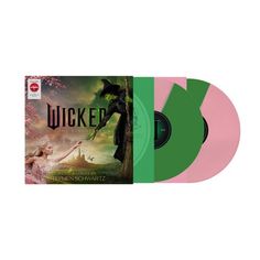 a pink and green colored vinyl album with the title's artwork on it, which is