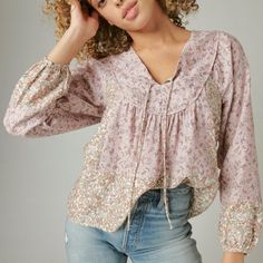 Crafted With Billowing Sleeves And An Allover Floral Pattern, This Classic Peasant Top Silhouette Is A Delightful Addition To Your Wardrobe Scoop Neck With Tie Closure Long Sleeves Soft Pink/Lilac Floral Print Size Xl New With Tags Msrp $89.50 Pink Long Sleeve Peasant Top With Floral Print, Pink Floral Print Peasant Top, Pink Floral Print Long Sleeve Peasant Top, Spring Peasant Top With 3/4 Sleeves, Pink V-neck Peasant Top With Floral Print, Boho Long Sleeve Top, Floral Peasant Top, Burgundy Shorts, Rayon Blouse