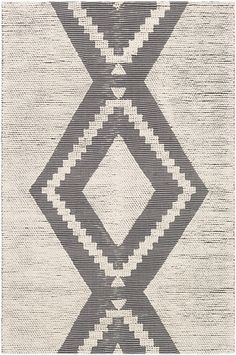 a black and white rug with diamond shapes on it