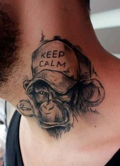 a man with a tattoo on his neck has a monkey wearing a hat and the words keep calm