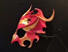 DESCRIPTIONRise from the ashes and transform anew wearing this gorgeous red & gold leather Phoenix Mask. This firebird piece is perfect for Carnivale or Bird CosPlay! Quality leather bird mask, fantastic for Carnivale or Mardi Gras costume. Any color. Waterproofed leather, glossy or matte finish, & several choices to affix the mask (cord, elastic, ribbon, waterproof cord). Measurements: 10" high x 14" wide (tallest & widest points); 10" high between the eyes; 3" wide x 1.5" tall eye Red Fantasy Masks And Prosthetics For Events, Red Fantasy Style Masks And Prosthetics For Events, Red Fantasy Style Masks And Prosthetics For Fantasy Events, Red Fantasy Masks And Prosthetics For Fantasy Events, Red Fantasy Masks And Prosthetics For Costumes, Fantasy Red Masks And Prosthetics For Costume Events, Fantasy Red Masks And Prosthetics For Costumes, Red Masks And Prosthetics For Carnival Festival, Red Masks And Prosthetics For Cosplay