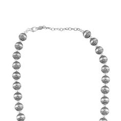 Add the shine of silver to any look with this versatile necklace made from real, nickel-free, stamped, .925 Sterling Silver native pearl beads with detailed concha engravings. The "native pearl" is a signature element of Southwestern fashion. The oxidized finish with polished accents help accentuate the intricate designs featured on each bead. Available in both 17 and 21 inch lengths, the necklace features a 3" textured extender, and fastens securely with a lobster-claw clasp. This necklace will Silver Necklaces With Oxidized Round Beads, Traditional Silver Pearl Necklace With Polished Beads, Silver Pearl Necklace With Large Beads For Gift, Silver Oxidized Necklaces With Round Beads, Silver Necklace With Oxidized Round Beads, Silver Necklace With Oxidized Finish And Round Beads, Southwestern Fashion, Squash Blossom Jewelry, Pearl Bead Necklace