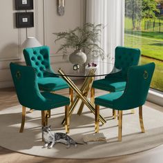 a dining room table with chairs and a cat laying on the floor in front of it