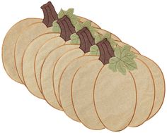 a set of five pumpkin placemats sitting on top of each other with leaves