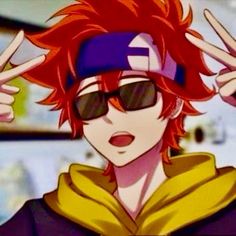 an anime character with red hair and sunglasses making the peace sign in front of him