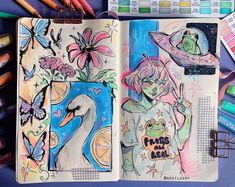 an open notebook with drawings and colored pencils