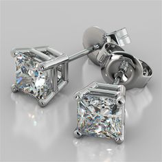 Elegant and refined, these princess cut stud earrings add an exceptional and glamorous look to your bride-to-be. Fashioned with an elegant 4-prong basket, each earring showcases a stunning princess-cut simulated diamonds that radiates unparalleled beauty. A look she will treasure forever.  Exquisitely made in 14K White Gold, this exceptional matched pair of stud earrings come with secured back posts for maximum comfort. Stone Size: 1.0CT Each Earring Stone Clarity: VS-1 Available in 14K White Go Elegant Princess Cut Diamond Earrings With Prong Setting, Elegant Princess Cut Earrings With Prong Setting, Princess Cut Earrings, Princess Cut Stud Earrings, Beautiful Diamond Earrings, Black Gold Jewelry, Stud Earrings For Men, White Gold Earrings Studs, White Gold Studs