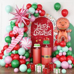 a christmas display with balloons, presents and decorations