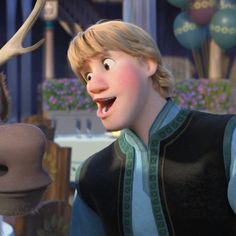 a young boy is standing next to a moose in the animated movie frozen princess and the frog prince