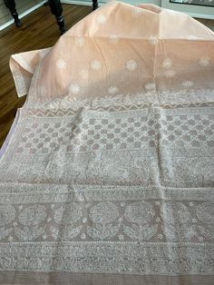 Type - chikankari Condition - brand new Material - pure kota cotton (soft)  Color - peachy pink Blouse piece included  Fall and picot done  hand embroidery work  Entire saree is hand embroidered, very meticulously and painstakingly done. The finishing of this saree is extremely good. White Cotton Saree With Chikankari Embroidery, Peach Chanderi Saree With Resham Embroidery, Peach Dupatta With Cutdana, Peach Cutdana Dupatta, Peach Chanderi Dupatta With Cutdana, Traditional Peach Dupatta With Intricate Embroidery, Unstitched Cotton Saree With Chikankari Embroidery, Unstitched Peach Saree With Resham Embroidery, Cotton Chikankari Embroidered Saree