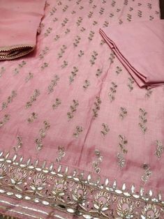 Item Overview ATHARVA Hand Embroidered Salwar Kameez in Pink w/ All Over Jaal w/Embroidered Border/ Gota Chandla Dupatta/Custom Stitching/Wedding/CH Dno. CH Fabric: * Shirt Chanderi 2.5 Mts, Pink Jaal Embroidery * Dupatta: Pure Chiffon Chinnon/ Dupatta with Gota Patti work 2.5 Mts. * Bottom Santoon Silk 2.5 Mts. Excusive Hand Embroidered Party Wear Punjabi Suit. Customization: * Fabrics: Designs Can be made in different Fabrics. * Stitching Available Care: * Dry Clean/ Avoid direct Ironing on Em Jaal Embroidery, Embroidery Dupatta, Embroidered Suits, Embroidered Salwar, Embroidery Suits Punjabi, Gota Patti Work, Embroidered Kurti, Gota Work, Embroidery Sweater