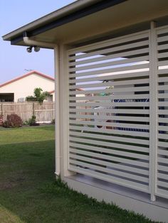 the side of a house with white slats on it