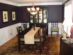 a dining room table with chairs and a china cabinet