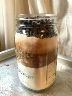 a glass jar filled with lots of chocolate chips