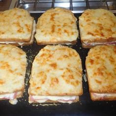 six square sandwiches sitting on top of a stove