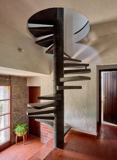 a spiral staircase in the middle of a room