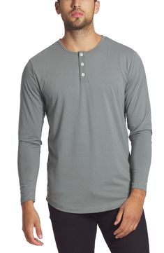 A curved hem and smooth cotton blend further the casual versatility of a long-sleeve henley that's easy to layer or wear alone. Crewneck Button half-placket Long sleeves 62% polyester, 33% cotton, 5% spandex Machine wash, dry flat Imported Casual Gray Henley For Fall, Everyday Long Sleeve Henley With Button Closure, Spring Long Sleeve Henley For Loungewear, Casual Long Sleeve Henley With Button Closure, Cotton Henley Loungewear With Henley Neckline, Cotton Long Sleeve Henley For Loungewear, Cotton Long Sleeve Henley For Layering, Solid Long Sleeve Henley For Layering, Solid Color Long Sleeve Henley For Layering