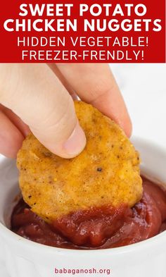 a person dipping something into a bowl with text overlay that reads sweet potato chicken nuggets hidden vegetable freeze - friendly