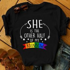 Lgbt She Is The Other Half Of My Rainbow Lgbt Pride 2D T-Shirt For Lgbt Community, Queer Lgbt, Gift For Lgbt Proud Month Trending 2024 Product Design By Alwaysky Fashion. A warm and stylish shirt that looks good in any situation. This shirt will make you seem your best thanks to its classic pattern, excellent fabric, and perfect fit. This shirt may be dressed up for a formal event or worn casually. It looks fantastic in any wardrobe. Utilize this vital piece to enhance your sense of style. #rain Black Crew Neck Top With Rainbow Print, Rainbow Letter Print Graphic Tee, Rainbow Graphic Tee With Letter Print, Rainbow Graphic Print Tops For Pride, Rainbow Letter Print Crew Neck Top, Black Crew Neck T-shirt With Rainbow Print, Multicolor Letter Print Tops For Pride, Black Letter Print Tops For Pride, Black Tops With Letter Print For Pride