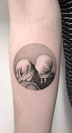 a black and white image of two hands holding each other in a circle tattoo on the arm