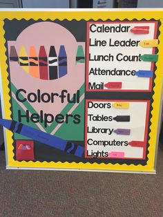 a colorful bulletin board with crayons on it