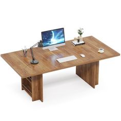 a wooden desk with a computer on it