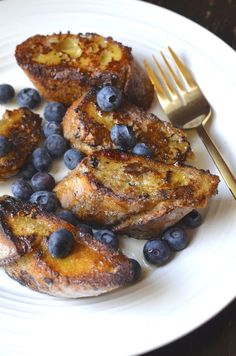 some blueberries and bananas on a white plate