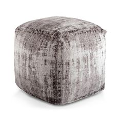 a large square ottoman in grey and white velvet with an upholstered design on the top