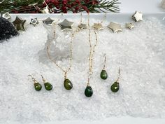 Choice of beautiful faceted Green Tourmaline Necklace or Earrings, each accented with a Herkimer diamond to give them that extra sparkle. Each gemstone is hand selected to match as closely as possible in this set. All stones come from the same strand of Green Tourmaline or Herkimer gemstones. Choose from: Green Tourmaline & Herkimer Necklace - Faceted Briolette on 16-18" gold filled chain. Briolette & Herkimer pendant measures 1 1/4" X 3/8". Pendant is removable for flexibility. Green Tourmaline