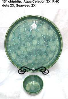 a green plate and bowl sitting next to each other