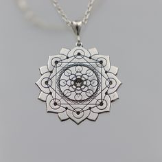 ★Item Details * Gender: Male / Female * Material:  925 Sterling Silver * Finish: Polished  * Chain : 925 Sterling Silver * Shipping: 2-5 days  * Handmade * Personalization: YES This unique silver necklace features a detailed design with three layers of 8 circles each, framed within an elegant lotus flower. Each petal of the lotus contains a circle, with an additional 8 circles in the center, and 8 more at the core. This intricate and meaningful design symbolizes harmony, balance, and spiritual a Spiritual Sterling Silver Necklace With Engraving, Spiritual Sterling Silver Engraved Necklace, Spiritual Engraved Sterling Silver Necklace, Engraved Spiritual Healing Jewelry, Etched Sterling Silver Necklaces, Silver Etched Sterling Silver Necklace, Spiritual Medallion Necklaces Stamped 925, Spiritual Medallion Necklace Stamped 925, Spiritual 925 Stamped Medallion Necklaces