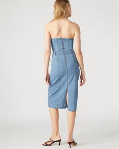 This denim dress combines the casual appeal of blue denim with the sophistication of a bustier top and pencil skirt. Perfect for a cocktail event or dinner out, the midi length offers just the right amount of coverage while still showing off your curves. Bustier denim midi dress Pencil skirt bottom Back zipper closure Length: 35.75" 98% cotton 2% spandex Hand wash Emma is 5ft 10in and is wearing a size small Imported Womens Denim Dress, Denim Midi Dress, Cocktail Event, Bustier Top, Spring Tops, Spring Looks, Sweaters Knitwear, Denim Fabric, Wearing Dress