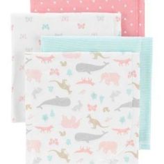 three napkins with dinosaurs on them and hearts in pink, blue, and white