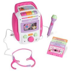 a pink and white toy radio with headphones