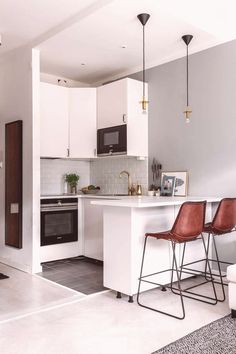 the kitchen is clean and ready to be used as a living room or dining area