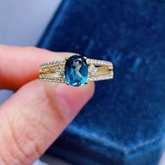 >>>> NATURAL TOPAZ RING <<<< Topaz size : 6*8 mm Topaz shape: Oval Cut gemstoneMain stone : blue topaz Side  stone : CZ diamond (cubic zircon)Metal color: silver, rose gold, gold  >>>>ABOUT BAND COLOR<<<>>> CUSTOM METALS <<<< Ring Size: From US #2 to US #15.Supply customized Solid Gold (9K, 14K and 18K White Gold/Rose Gold/ Gold). Customize Engraved: Accept name or some simple icon on ring band. It's laser engraving. :-)Please con Blue Topaz Birthstone Ring Fine Jewelry, Blue Topaz Ring With Birthstone, Blue Topaz Diamond Ring As Gift, Blue Topaz Crystal Ring With Center Stone, Blue Topaz Crystal Ring With Gemstone, Blue Crystal Ring With Center Stone Blue Topaz, Blue Topaz Gemstone Crystal Ring, Blue Crystal Open Ring With Accent Stones, Elegant Blue Birthstone Open Ring