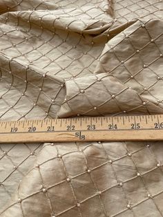 Article: 2084 content: 100% silk width: 55-56" finished width: 50" length: one full yard. description:  fantastic quality, champagne shade - shantung quilt with pearl. approximate size of the quilt 1.2", tone on tone champagne shade pearl hand embroidered on top.  silk shantung is a material with a rough, nubby surface, made on machines instead of hand woven. less prominent slubs, more uniform in texture. the high quality yarn used in this fabric is generally from china. this silk is considered Luxury Gold Silk Thread Sets, King Size Pillow Shams, Silk Taffeta, Tone On Tone, Embroidered Silk, Evening Wear, Hand Woven, Hand Embroidered, Interior Decorating