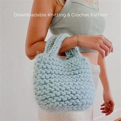 a woman is holding a crocheted purse