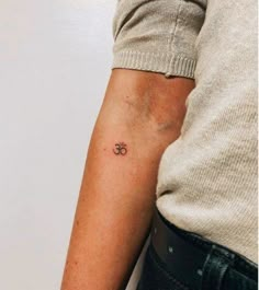 a person with a small tattoo on their arm