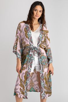 Our Regal Medallion Printed Midi Duster showcases stunning large paisleys and regal medallion patterns, interwoven with botanical and floral motifs. Designed to flatter, its midi length enhances the legs while providing an elegant drape, thanks to its lightweight, breathable fabric. Complete with a fabric belt closure, it offers versatility as a chic beach or resort cover-up.


Materials: 100% Rayon Spring Bohemian Paisley Print Kimono, Bohemian Long Kimono With Paisley Print, Long Bohemian Kimono With Paisley Print, Spring Kimono With Paisley Print And Kimono Sleeves, Bohemian Kimono With Paisley Print For Vacation, Long Paisley Print Kimono For Beach, Bohemian Beach Kimono With Paisley Print, Long Kimono With Paisley Print For Beach, Spring Paisley Print Open Front Kimono