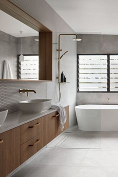 a bathroom with two sinks and a bathtub