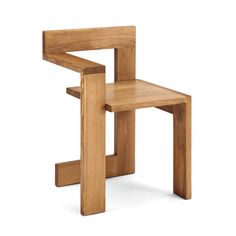 a wooden chair sitting on top of a white floor