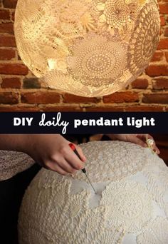 a woman is using a lamp shade to make it look like an intricate lace ball